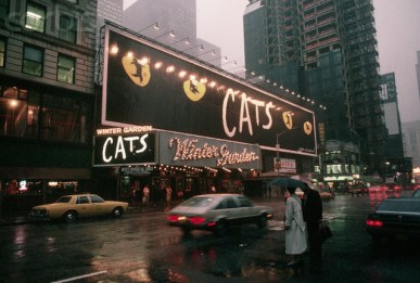 September 1989 --- Lights shine on a billboard advertising the Broadway show "Cats" over the Winter Garden theater in New York City. | Location: 1634 Broadway, New York, New York, USA. --- Image by © Michael S. Yamashita/Corbis
